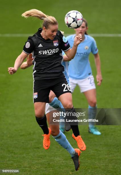 Amandine Henry of Lyon wins a header during the UEFA Women's Champions League Semi Final, first leg match between Manchester City Women and Lyon at...