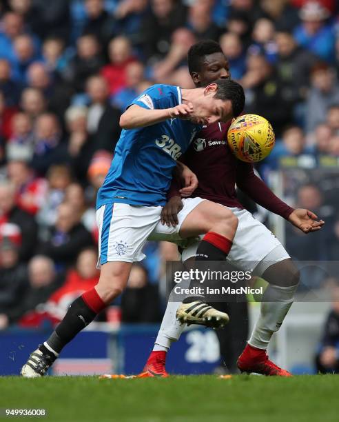 Graham Dorrans of Rangers vies with Danny Amankwaa of Heart of Midlothian during the Ladbrokes Scottish Premiership match between Rangers and Hearts...