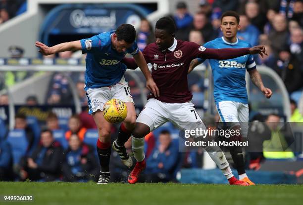 Graham Dorrans of Rangers vies with Danny Amankwaa of Heart of Midlothian during the Ladbrokes Scottish Premiership match between Rangers and Hearts...