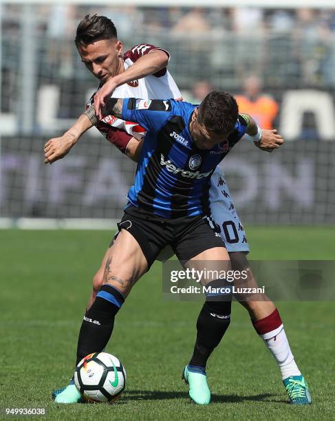 Alejandro Dario Gomez of Atalanta BC is challenged by Simone Edera of Torino FC during the serie A match between Atalanta BC and Torino FC at Stadio...