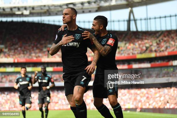Marko Arnautovic of West Ham United celebrates scoring his side's first goal with Manuel Lanzini during the Premier League match between Arsenal and...