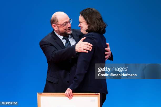 Andrea Nahles hugs Martin Schulz at a federal party congress of the German Social Democrats following her election as new party leader on April 22,...