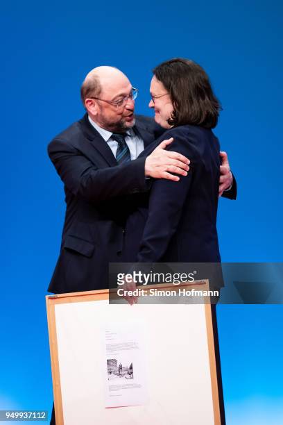 Andrea Nahles hugs Martin Schulz at a federal party congress of the German Social Democrats following her election as new party leader on April 22,...