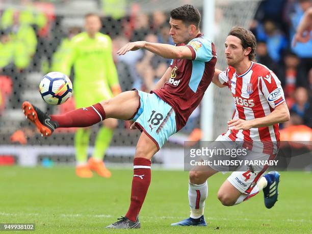 Stoke City's Welsh midfielder Joe Allen vies with Burnley's English midfielder Ashley Westwoodduring the English Premier League football match...