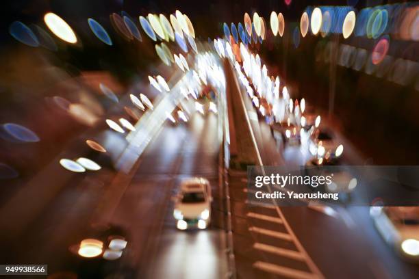 car traffic at night. motion blurred background.shanghai city,china - thruway stockfoto's en -beelden