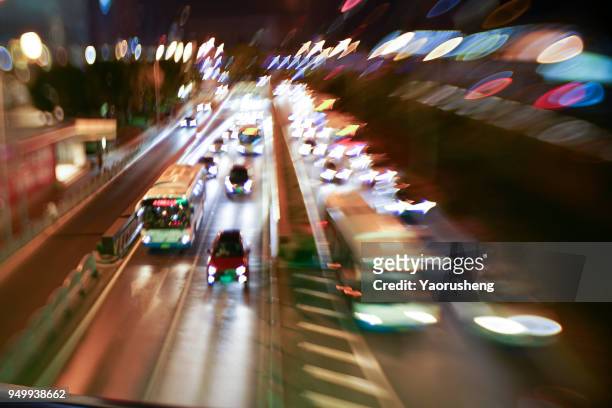 car traffic at night. motion blurred background.shanghai city,china - thruway - fotografias e filmes do acervo