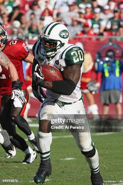 Running Back Thomas Jones of the New York Jets rushes for the second of two touchdowns against the Tampa Bay Buccaneers whent eh Tampa Bay Buccaneers...