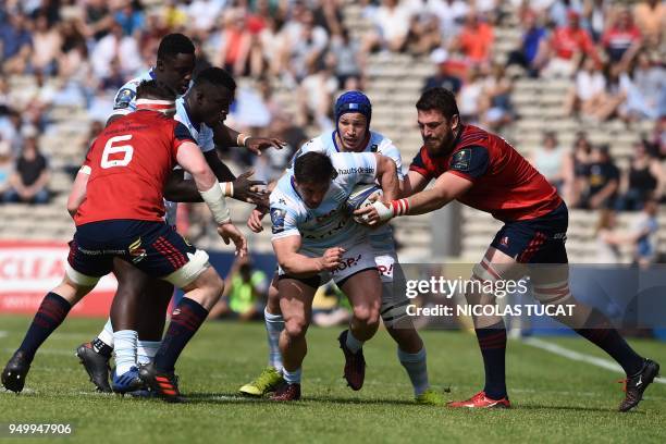 Racing 92's French hooker Camille Chat runs to evade Munster's South African lock Jean Kleyn during the European Champions Cup semi-final rugby union...