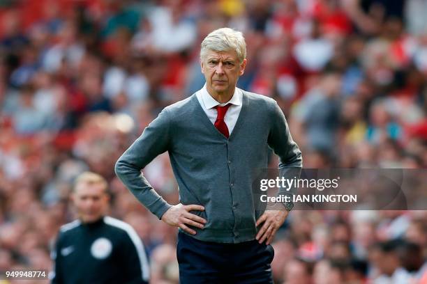 Arsenal's French manager Arsene Wenger watches on from the touch line during the English Premier League football match between Arsenal and West Ham...