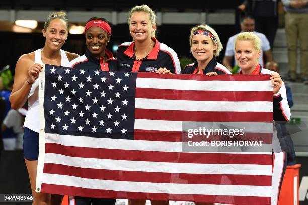 Team Madison Keys, Sloane Stephens, CoCo Vandeweghe, Bethanie Mattek-Sands, and Kathy Rinaldi-Stunkel pose with a national flag after their victory...