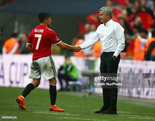 Manchester United's Alexis Sanchez shanks hands with Manchester United manager Jose Mourinho during the FA Cup semi-final match between Tottenham...