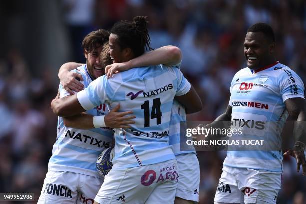 Racing 92's French scrum-half Maxime Machenaud celebrates with teammates after scoring a try during the European Champions Cup semi-final rugby union...