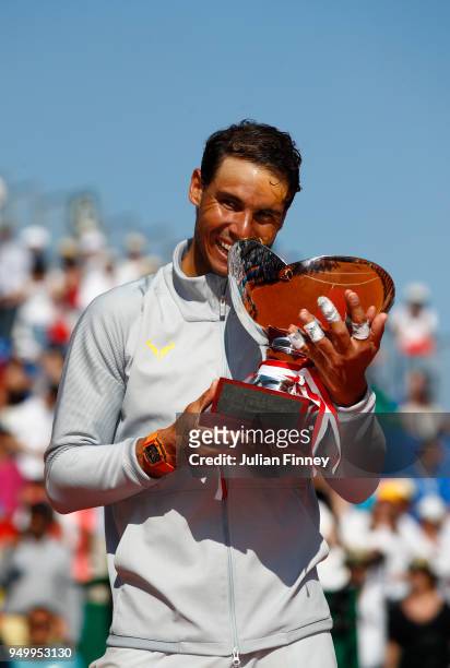 Rafael Nadal of Spain holds his winners trophy after winning the Monte Carlo Rolex Masters against Kei Nishikori of Japan during day eight of ATP...