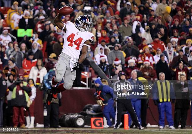 Ahmad Bradshaw of the New York Giants celebrates after scoring on a three-yard touchdown in the first quarter against the Washington Redskins at...