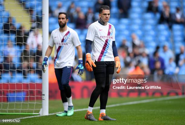 Claudio Bravo and Ederson of Manchester City warm up ahead of the Premier League match between Manchester City and Swansea City at Etihad Stadium on...