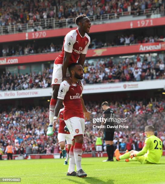 Alexandre Lacazette celebrates scoring Arsenal's 3rd goal with Danny Welbeck during the Premier League match between Arsenal and West Ham United at...
