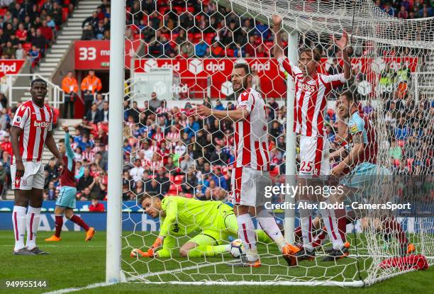 Players react after Burnley's Ashley Barnes scored the equaliser during the Premier League match between Stoke City and Burnley at Bet365 Stadium on...