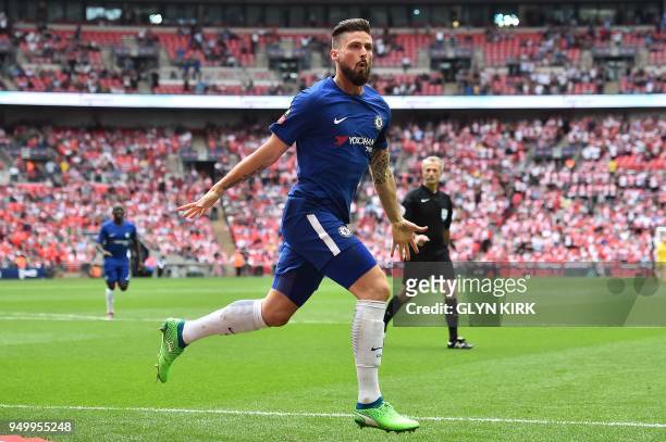 Chelsea's French striker Olivier Giroud celebrates scoring the opening goal during the English FA Cup semi-final football match between Chelsea and...