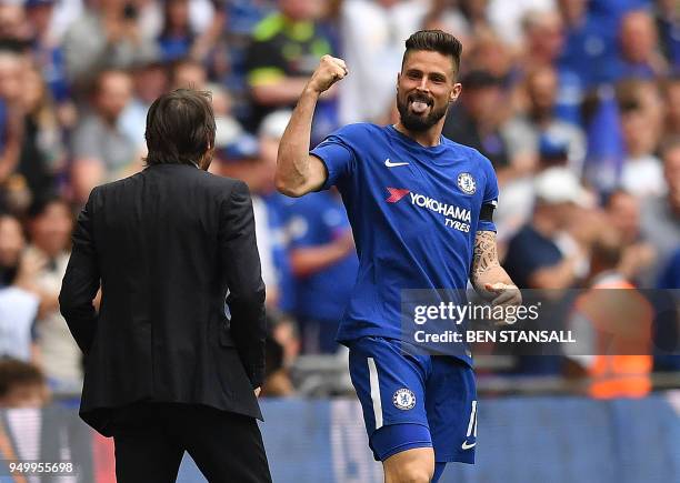 Chelsea's French striker Olivier Giroud celebrates with Chelsea's Italian head coach Antonio Conte after scoring the opening goal during the English...