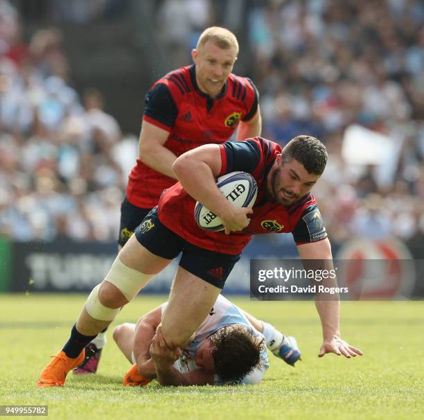 Sammy Arnold of Munster is held by Henry Chavancy during the European Rugby Champions Cup Semi-Final match between Racing 92 and Munster Rugby at...