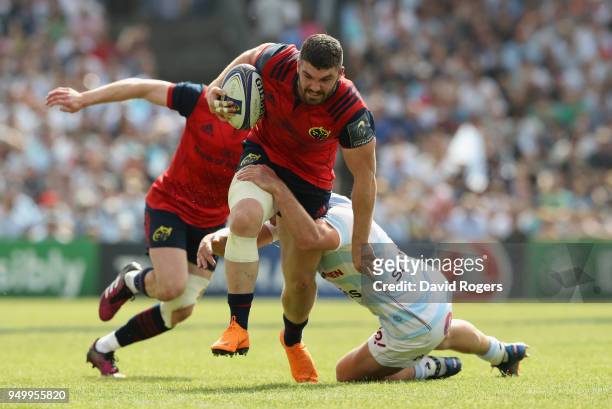 Sammy Arnold of Munster is held by Henry Chavancy during the European Rugby Champions Cup Semi-Final match between Racing 92 and Munster Rugby at...