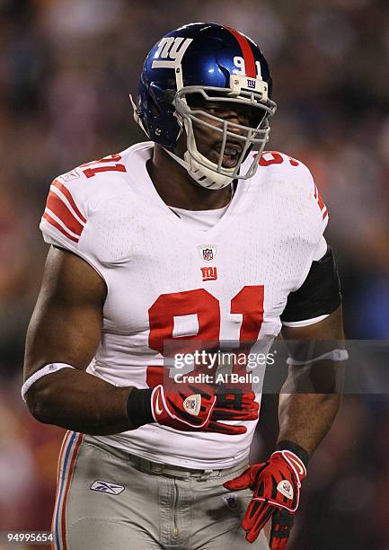 Justin Tuck of the New York Giants reacts after a sack in the first half against the Washington Redskins at FedEx Field on December 21, 2009 in...