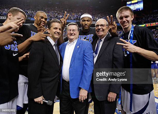John Calipari the Head Coach of the Kentucky Wildcats is pictured with Joe Hall and Herky Rupp after the 88-44 victory over the Drexel Dragons at...