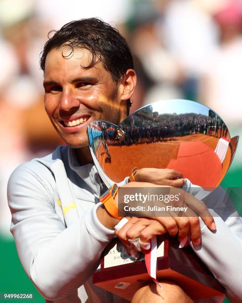 Rafael Nadal of Spain celebrates with the trophy after winning the Monte Carlo Rolex Masters against Kei Nishikori of Japan during day eight of ATP...