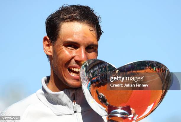 Rafael Nadal of Spain celebrates with the trophy after winning the Monte Carlo Rolex Masters against Kei Nishikori of Japan during day eight of ATP...