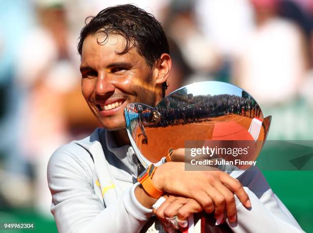 Rafael Nadal of Spain celebrates with the trophy after winning the Monte Carlo Rolex Masters against Kei Nishikori of Japan during day eight of ATP...