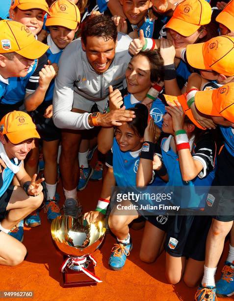Rafael Nadal of Spain celebrates with the ball boys and girls after winning the Monte Carlo Rolex Masters against Kei Nishikori of Japan during day...