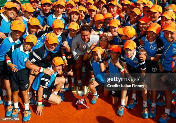 Rafael Nadal of Spain celebrates with the ball boys and girls after winning the Monte Carlo Rolex Masters against Kei Nishikori of Japan during day...