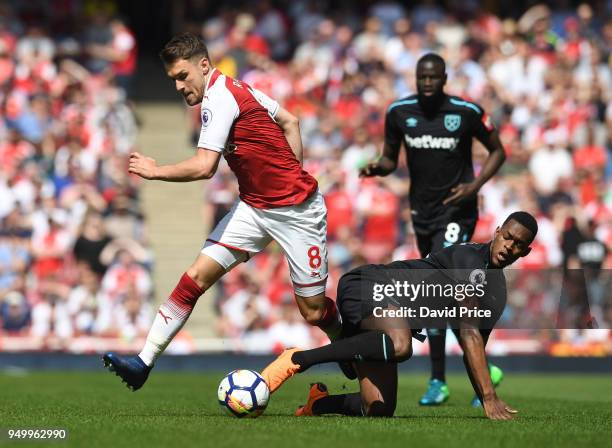 Aaron Ramsey of Arsenal takes on Edimilson Fernandes of West Ham during the Premier League match between Arsenal and West Ham United at Emirates...