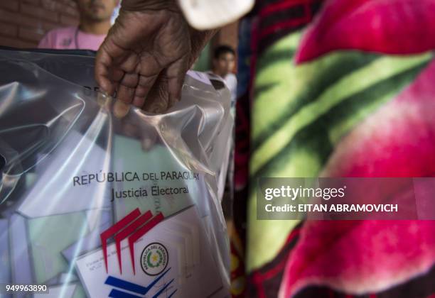 An indigenous woman member of Maka tribe votes at a polling station in Mariano Roque Alonso, outskirts of Asuncion on April 22 during Paraguay's...
