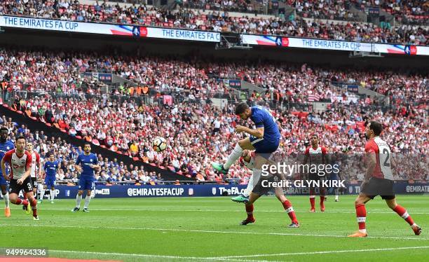 Chelsea's Spanish striker Alvaro Morata heads the ball to score his team's second goal uring the English FA Cup semi-final football match between...