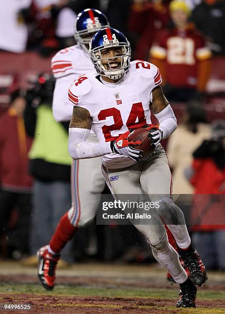 Terrell Thomas of the New York Giants reacts after returning a third-quarter interception for a touchdown against the Washington Redskins at FedEx...