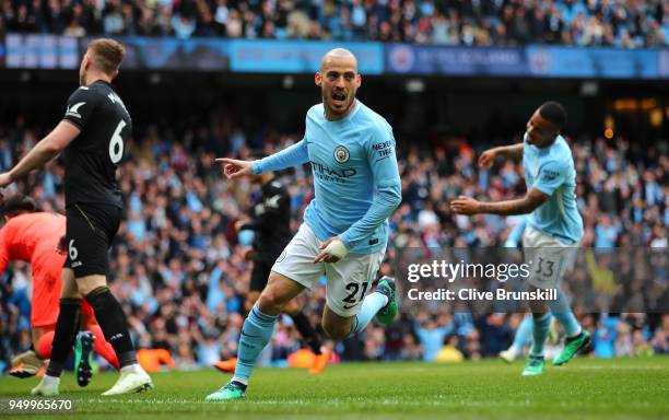 David Silva of Manchester City celebrates scoring his side's first goal during the Premier League match between Manchester City and Swansea City at...