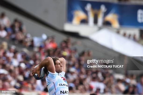 Racing 92's French hooker Dimitri Szarzewski throws the ball during the European Champions Cup semi-final rugby union match between Racing 92 and...