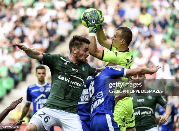 Troyes' French goalkeeper Erwin Zelazny and Troyes' French midfielder Stephane Darbion vies with Saint-Etienne's French defender Mathieu Debuchy...