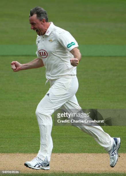 Surrey's Rikki Clarke celebrates after taking the wicket of Hampshire's Jimmy Adams during day three of the Specsavers County Championship Division...