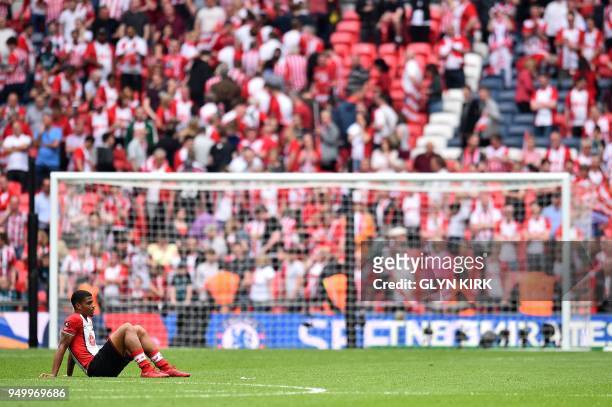 Southampton's Gabonese midfielder Mario Lemina reacts following the English FA Cup semi-final football match between Chelsea and Southampton at...