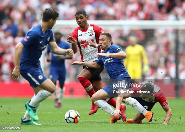 Eden Hazard of Chelsea holds off Cedric Soares and Mario Lemina of Southampton during the The Emirates FA Cup Semi Final match between Chelsea and...