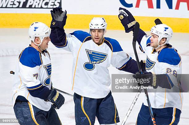 Keith Tkachuk, Andy McDonald and Carlo Colaiacovo of the St. Louis Blues celebrate a third period goal against the Edmonton Oilers at Rexall Place on...