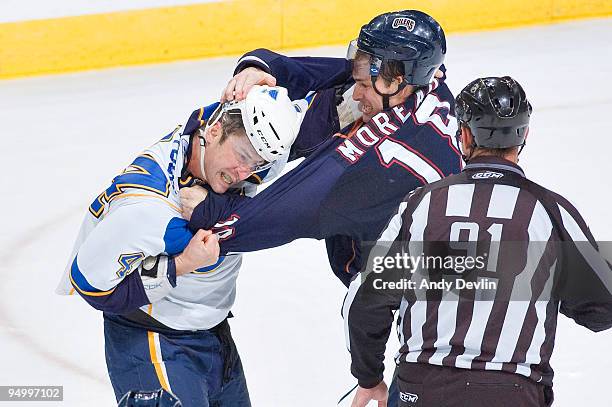 Ethan Moreau of the Edmonton Oilers drops the gloves with Darryl Sydor of the St. Louis Blues during the third period of a game at Rexall Place on...