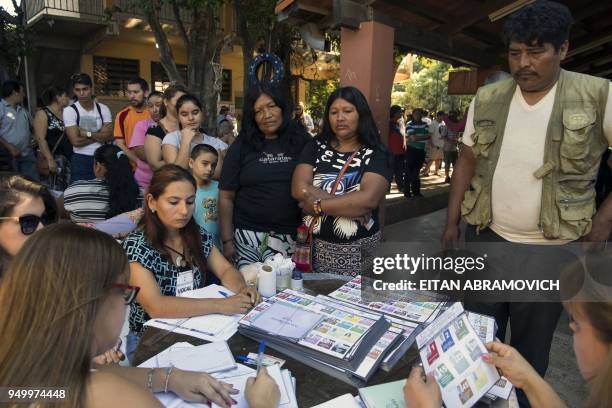 People queue to vote at a polling station in Mariano Roque Alonso, outskirts of Asuncion on April 22 during Paraguay's presidential election. -...