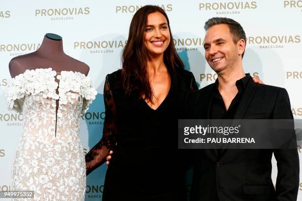 Russian model Irina Shayk and Pronovias' French creative director Herve Moreau present a creation of the Pronovias 2019 collection ahead of the...