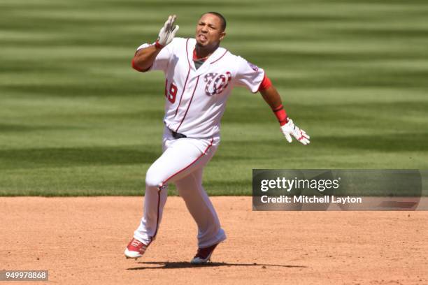 Moises Sierra of the Washington Nationals runs to third base during a baseball game against the Colorado Rockies at Nationals Park on April 14, 2018...