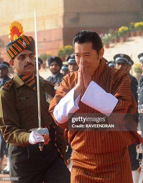 King of Bhutan, Jigme Khesar Namgyel Wangchuck greets Indian army soldiers during a welcome ceremony at the Presidential Palace in New Delhi on...