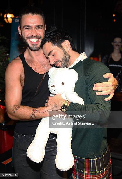 Lorenzo Martone and fashion designer Marc Jacobs attend DavidBartonGym's toy drive for kids at DavidBartonGym on December 21, 2009 in New York City.