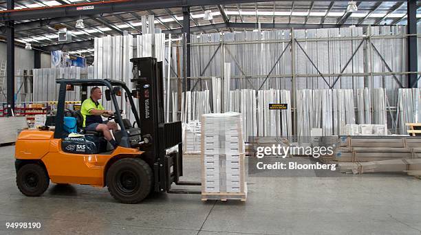 An employee driving a forklift transports pallets of aluminum products at the Ullrich Aluminium Co. Factory in Auckland, New Zealand, on Tuesday,...